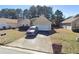A single-story home features a driveway, two-car garage, and well-maintained lawn at 1394 Isleworth Cir, Atlanta, GA 30349