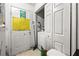 Practical mud room with access to laundry and storage solutions at 1394 Isleworth Cir, Atlanta, GA 30349