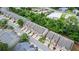 Aerial view of townhomes showcasing architecture, landscaping, and street layout in a well-maintained neighborhood at 147 Townview Dr, Woodstock, GA 30189
