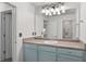 Bathroom boasts a large mirror and a stylish vanity at 147 Townview Dr, Woodstock, GA 30189