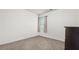 Cozy bedroom with neutral carpet and natural light from the window at 147 Townview Dr, Woodstock, GA 30189