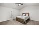 Bright bedroom featuring a ceiling fan, a window with curtains, and a bed at 147 Townview Dr, Woodstock, GA 30189