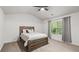 Bright bedroom featuring a ceiling fan, a window with curtains, and a bed at 147 Townview Dr, Woodstock, GA 30189