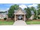 Exterior of the community clubhouse featuring stonework and landscaping at 147 Townview Dr, Woodstock, GA 30189