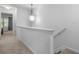Bright hallway features a carpeted floor and stairs at 147 Townview Dr, Woodstock, GA 30189