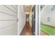 Inviting entryway hallway with dark hardwood floors, neutral walls, and modern lighting at 147 Townview Dr, Woodstock, GA 30189