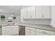 Bright kitchen with granite countertops, stainless steel appliances, and lots of cabinet space at 147 Townview Dr, Woodstock, GA 30189