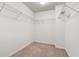 Bright walk-in closet featuring carpet flooring and wired shelves at 147 Townview Dr, Woodstock, GA 30189