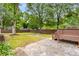 Spacious backyard with a deck and a large flagstone patio at 1927 Alexander Se St, Smyrna, GA 30080