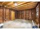 Unfinished basement space with exposed wood framing and concrete floor at 1927 Alexander Se St, Smyrna, GA 30080