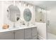 Bright bathroom with a double sink vanity and frameless glass shower enclosure at 1927 Alexander Se St, Smyrna, GA 30080