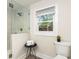 Bright bathroom with a frameless glass shower enclosure and modern fixtures at 1927 Alexander Se St, Smyrna, GA 30080