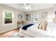 Relaxing bedroom featuring white bedding, wood floors, and lots of natural light at 1927 Alexander Se St, Smyrna, GA 30080