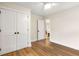 Spacious bedroom with hardwood floors, ceiling fan, and large closet at 1927 Alexander Se St, Smyrna, GA 30080