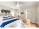 Relaxing bedroom with decor, wood floors, and an adjacent ensuite bathroom at 1927 Alexander Se St, Smyrna, GA 30080