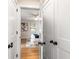 Bright bedroom with hardwood floors, white trim, and view into bedroom from doorway at 1927 Alexander Se St, Smyrna, GA 30080