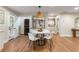 The dining area features an adjacent laundry closet with a stacked washer and dryer at 1927 Alexander Se St, Smyrna, GA 30080