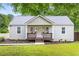 Charming single-story home featuring a cozy front porch, fresh landscaping, and inviting curb appeal at 1927 Alexander Se St, Smyrna, GA 30080