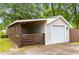 Garage with an attached lean-to and a roll up garage door at 1927 Alexander Se St, Smyrna, GA 30080