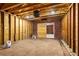 Interior view of garage showing the open stud construction and sliding door into another space at 1927 Alexander Se St, Smyrna, GA 30080