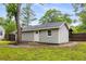 Detached one car garage situated in a fenced backyard with a tree at 1927 Alexander Se St, Smyrna, GA 30080