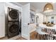 The dining area features an adjacent laundry closet with a stacked washer and dryer at 1927 Alexander Se St, Smyrna, GA 30080