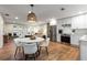 Open-concept living area with stainless steel appliances, white cabinets and modern furnishings at 1927 Alexander Se St, Smyrna, GA 30080