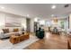 Open-concept living room and kitchen with modern appliances, stylish decor, and hardwood floors at 1927 Alexander Se St, Smyrna, GA 30080