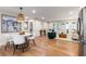 Open-concept living area with wood floors and modern furnishings under a woven chandelier at 1927 Alexander Se St, Smyrna, GA 30080