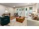 Comfortable living space featuring hardwood floors, a stylish accent chair, and seamless access to the outdoors at 1927 Alexander Se St, Smyrna, GA 30080