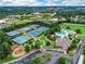 Aerial view of tennis courts, pool, parking, and club house for community at 3250 Seven Oaks Dr, Cumming, GA 30041