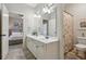 Well-appointed bathroom with double vanity, a separate toilet room and full shower and tub at 3250 Seven Oaks Dr, Cumming, GA 30041