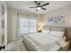 Cozy bedroom with soft carpet, ceiling fan, and natural light creating a welcoming space at 3250 Seven Oaks Dr, Cumming, GA 30041