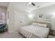 Cozy bedroom featuring vaulted ceiling, ceiling fan, double door closet and a unique circular window at 3250 Seven Oaks Dr, Cumming, GA 30041