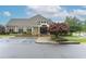 Community clubhouse exterior with accessible parking, manicured landscaping, and inviting entrance at 3250 Seven Oaks Dr, Cumming, GA 30041