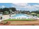 Large community pool with clear water, lounge chairs, umbrellas, and a fun water slide at 3250 Seven Oaks Dr, Cumming, GA 30041