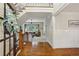 Inviting foyer with hardwood floors, staircase, and view into the light-filled living room at 3250 Seven Oaks Dr, Cumming, GA 30041