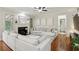 Bright living room featuring a fireplace, hardwood floors and a large sofa, offering a comfortable space at 3250 Seven Oaks Dr, Cumming, GA 30041