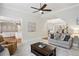 Spacious living room with a stylish sofa, coffee table, and easy access to other rooms at 3250 Seven Oaks Dr, Cumming, GA 30041