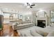 Spacious living space with a fireplace, hardwood floors, an open kitchen and lots of natural light at 3250 Seven Oaks Dr, Cumming, GA 30041
