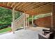 Outdoor patio featuring a covered area, seating, string lights, and beautiful brickwork at 3250 Seven Oaks Dr, Cumming, GA 30041
