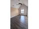 Bright bedroom boasts vaulted ceilings, a ceiling fan, a window and hardwood floors at 4160 Post Oak Grv, Atlanta, GA 30349