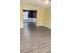 Bright living room with hardwood floors that opens to the dining room through an archway at 4160 Post Oak Grv, Atlanta, GA 30349