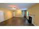 Spacious living room with hardwood floors, a cozy fireplace, and ample natural light at 4160 Post Oak Grv, Atlanta, GA 30349
