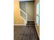Second staircase leading to the primary bedroom with hardwood flooring at 4160 Post Oak Grv, Atlanta, GA 30349