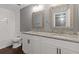 Bright bathroom features granite countertops, dual sinks, and large vanity mirrors at 5400 Roswell Rd # Apt E6, Sandy Springs, GA 30342