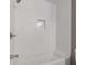 Clean white bathroom with tiled walls and a bathtub at 5400 Roswell Rd # Apt E6, Sandy Springs, GA 30342