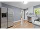 Modern kitchen featuring stainless steel appliances, white cabinets, and hardwood floors at 5400 Roswell Rd # Apt E6, Sandy Springs, GA 30342