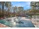 The neighborhood pool and picnic tables offer spaces for residents to relax and enjoy the outdoors at 7265 Hunters Branch Dr, Sandy Springs, GA 30328