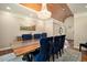 Elegant dining room with hardwood floors, designer chandelier, and stylish seating at 7265 Hunters Branch Dr, Sandy Springs, GA 30328